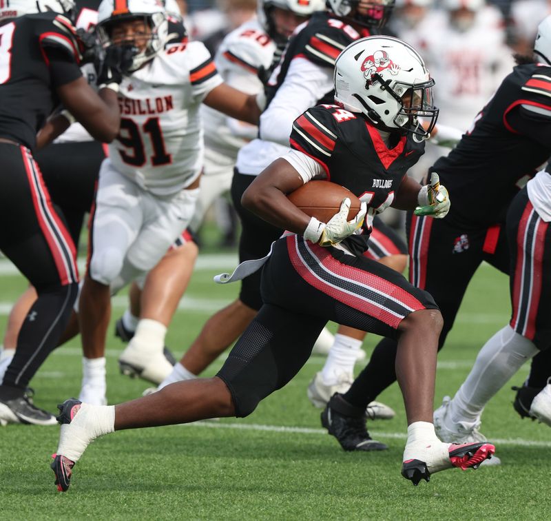 McKinley’s Kyelin West runs for a gain in the first half against Massillon at McKinley Saturday, October. 25, 2025.