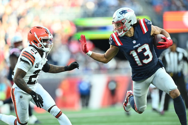 Oct 26, 2025; Foxborough, Massachusetts, USA; New England Patriots wide receiver Mack Hollins (13) runs with the ball against Cleveland Browns cornerback Denzel Ward (21) during the fourth quarter at Gillette Stadium. Mandatory Credit: Brian Fluharty-Imagn Images