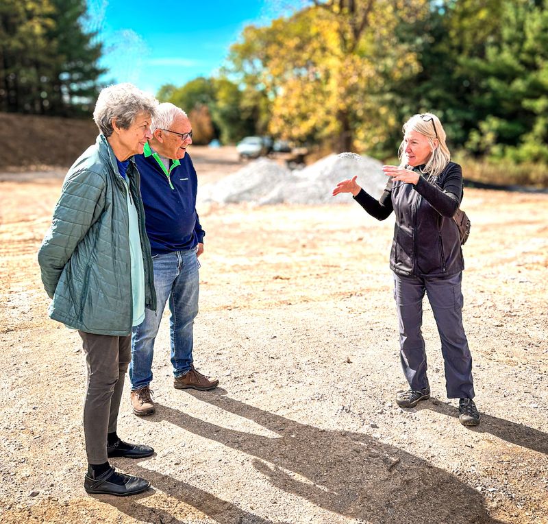 Christine Craycroft, executive director of Portage Park District, speaks with participants during a recent preview of Kame Esker Bog Park in Brimfield Township.