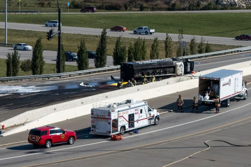 Emergency crews work the site of a tanker fire at the Union Center Blvd. exit of I-75 in West Chester, Ohio, on Tuesday, Oct. 28, 2025.