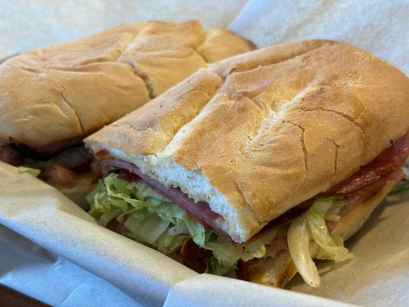An Italian sub with salami, capicola, pepperoni, ham, black olives, lettuce tomato, onion and Italian dressing from Michael's Catering and Café