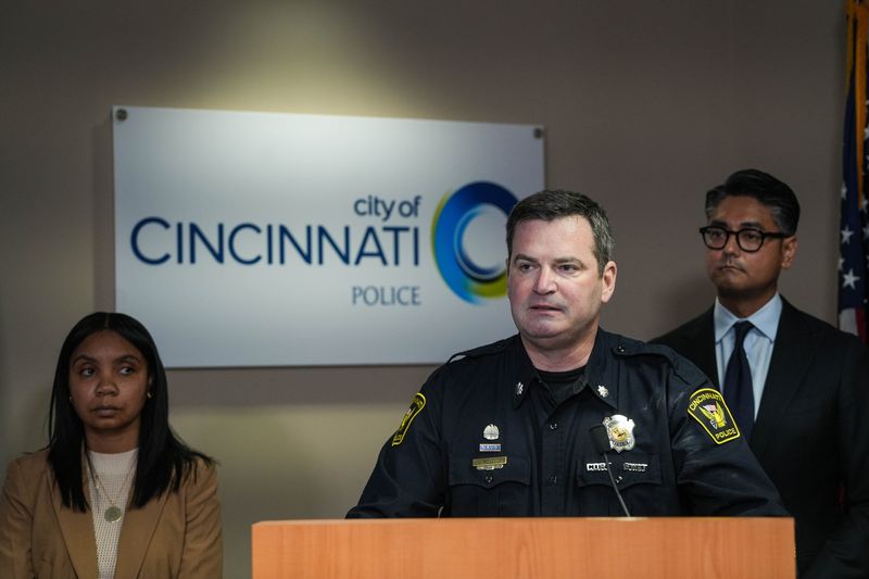 Interim Police Chief Adam Hennie, City Manager Sheryl Long and Mayor Aftab Pureval during a news conference in October 2025.