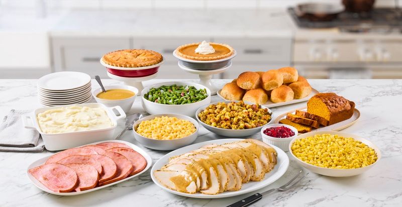 Bob Evans' Premium Farmhouse Feast includes turkey, ham, dressing, mashed potatoes, gravy, corn, green beans, cranberry relish, macaroni and cheese, rolls, apple pie, pumpkin pie and pumpkin bread.