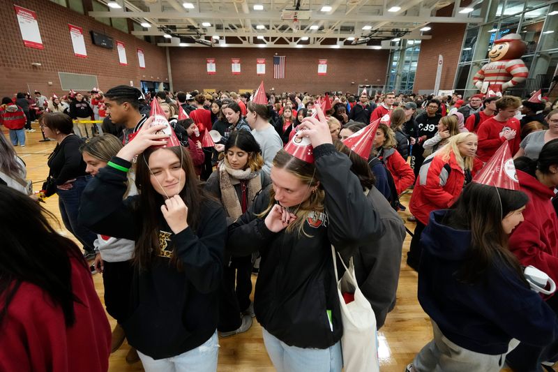 Nearly 2,000 Ohio State fans gathered at Ohio State University's Recreation and Physical Activity Center for Brutus Buckeye's 60th birthday party on Oct. 29, 2025. Attendees broke a Guinness World Record for the largest gathering of people wearing conical party hats.