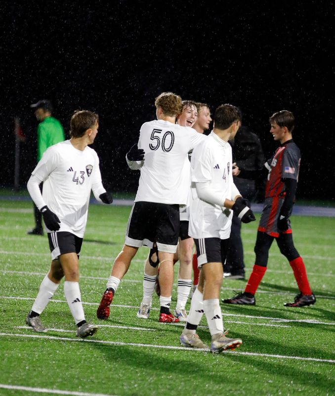 River View's Cash Guilliams gets a hug from senior Brody Johnson, middle, after River View closed out a 3-0 win against St. Clairsville in a Division IV regional semifinal on Wednesday, Oct. 30, 2025, at McFarland Stadium in Cambridge, Ohio.