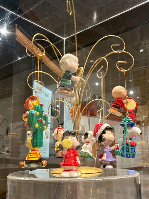 Peanuts-themed Christmas tree ornaments are among the holiday novelties on display in the "Merry Christmas, Charlie Brown" traveling exhibition on display in the Keller Gallery of the McKinley museum.