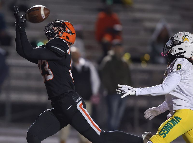 Hoover’s Brycen Beyer reels in a touchdown pass in the first half half against Columbus Northland in a Division II, Region 7 first-round playoff game at Hoover, Friday, October. 31, 2025.