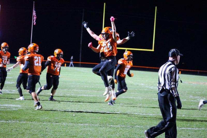 North Union's Nick VanHoose (24) celebrates with his teammates after scoring a touchdown in the first half of the Division V, Region 20 football playoff opener in Richwood Oct. 31, 2025.