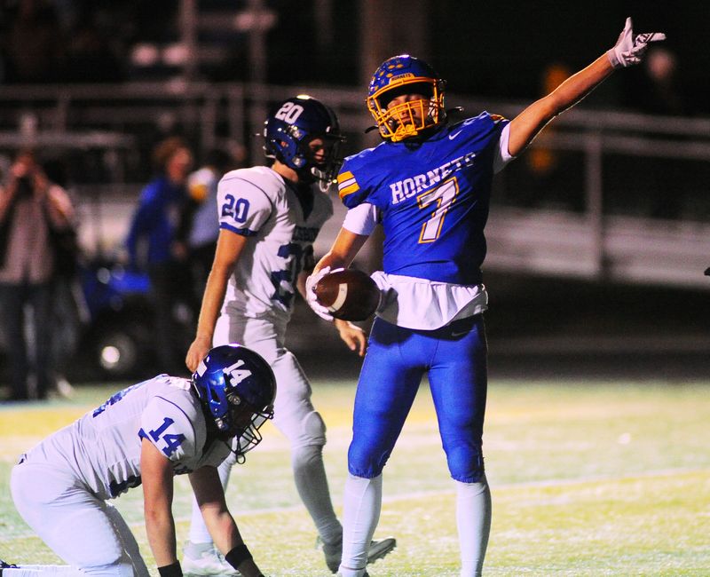 East Canton's Canaan Pollard signals a first down in a OHSAA playoff game against Lisbon at Foltz Stadium, Friday, Oct. 31, 2025.