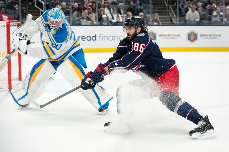 Columbus Blue Jackets right wing Kirill Marchenko (86) chases down a puck beside St. Louis Blues goaltender Joel Hofer (30) during the first period of the NHL hockey game at Nationwide Arena in Columbus on Nov. 1, 2025.