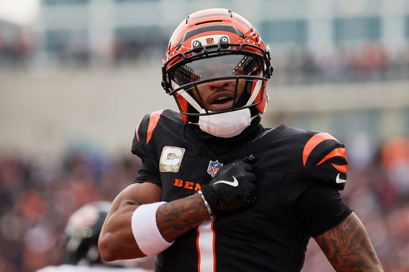 Nov 2, 2025; Cincinnati, Ohio, USA; Cincinnati Bengals wide receiver Ja'Marr Chase (1) acknowledges the crowd after scoring a touchdown against the Chicago Bears during the second quarter at Paycor Stadium. Mandatory Credit: Joseph Maiorana-Imagn Images