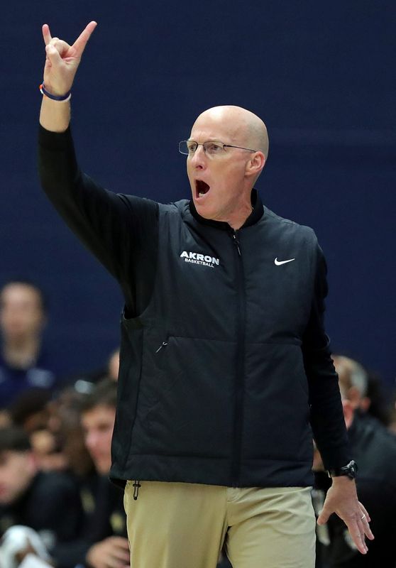 Akron Zips head coach John Groce works the sideline during the first half of an NCAA college basketball game at James A. Rhodes Arena, Nov. 3, 2025, in Akron, Ohio