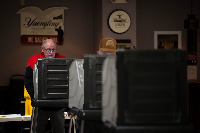 A voter casts his ballot at the American Legion in Newark, Ohio, on Election Day, Nov. 4, 2025.
