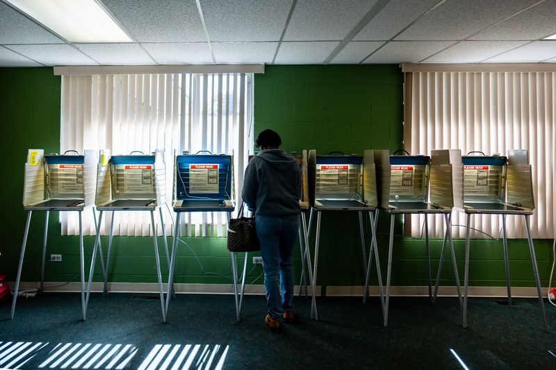 A woman votes at Heart 4 The City Church on Election Day, Nov. 4, 2025, in Akron, Ohio.