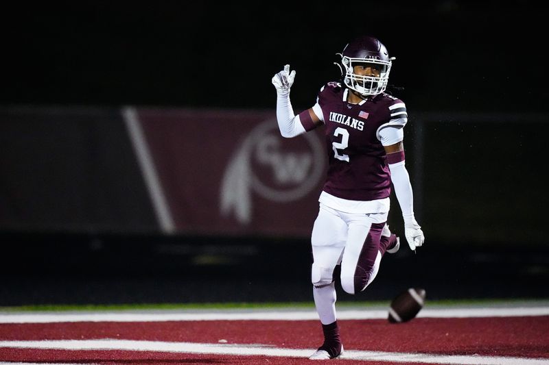 Canal Winchester's Dre Jackson (2) celebrates after scoring a touchdown in the first half of the Division II, Region 7 quarterfinal playoff game at Canal Winchester High School on Friday, Nov. 7, 2025 in Canal Winchester, Ohio.