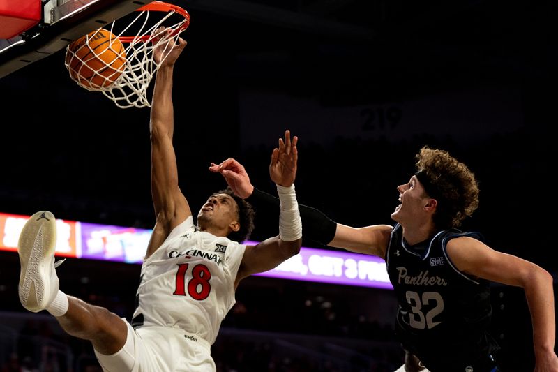 Cincinnati Bearcats forward Baba Miller (18) dunks and draws a foul from Georgia State Panthers center Christian Beam (32) last Nov. 7 at Fifth Third Arena.