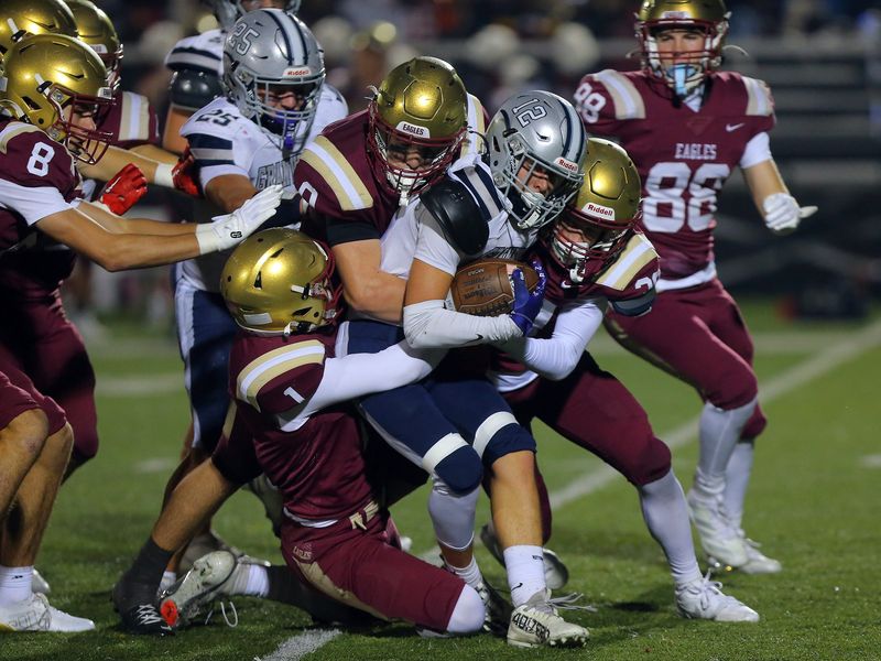 Watterson tacklers wrap up Granville's Landon Goss during the Eagles' 56-0 win in a Division III, Region 11 quarterfinal Nov. 7 at Ohio Dominican.