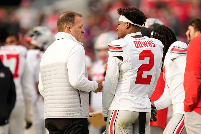 Ohio State Buckeyes defensive back Caleb Downs (2) talks to athletic director Ross Bjork during the NCAA football game against the Purdue Boilermakers at Ross-Ade Stadium in West Lafayette, Ind. on Nov. 8, 2025. Ohio State won 34-10.