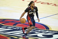 Nov 5, 2025; Cleveland, Ohio, USA; Cleveland Cavaliers guard Darius Garland (10) brings the ball up court in the fourth quarter against the Philadelphia 76ers at Rocket Arena.