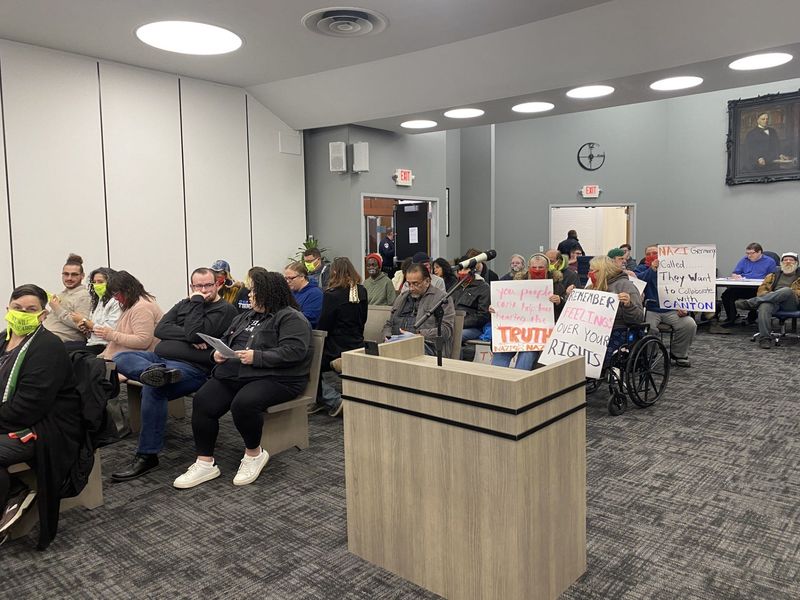 Attendees at Canton City Council's Nov. 10 meeting held signs criticizing the proposal to eliminate public speaks. Some wore masks with messages such as "WE WILL BE HEARD."