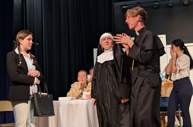Kail Jones, Sophia Bluck, Jensen Cunningham rehearse a scene from "Holy Mother of Bingo! A Murder Mystery" being presented at Ridgewood High School.