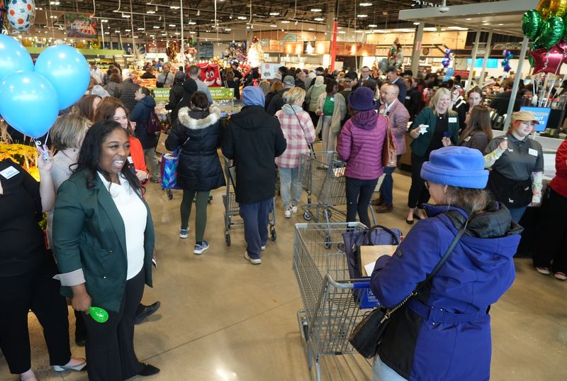 Food safety manager Bethany James greets customers as Kroger opened the doors on their newest store in Powell Nov 14, 2025.
