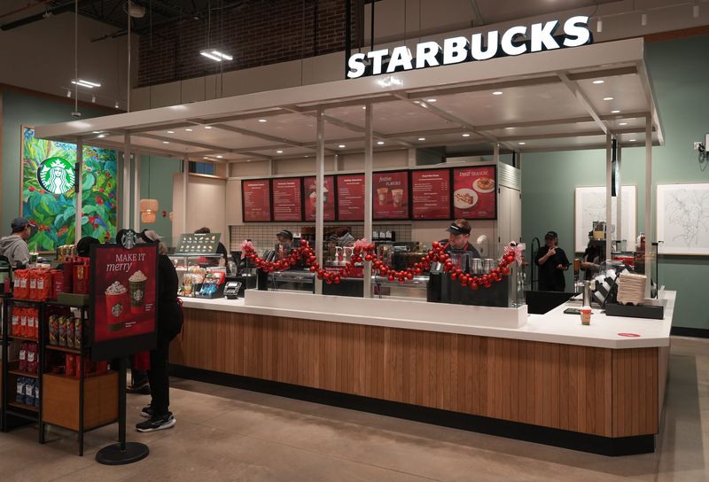Employees work the Starbucks counter as Kroger opened the doors on their newest store in Powell Nov 14, 2025.