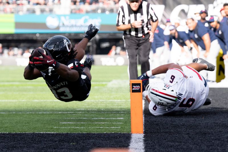 Cincinnati Bearcats running back Zion Johnson (13) dives for the end zone Nov. 15 at Nippert Stadium against Arizona.