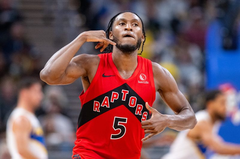 Toronto Raptors guard Immanuel Quickley (5) reacts after scoring a 3-point shot during the first half of an NBA basketball game against the Indiana Pacers, Saturday, Nov. 15, 2025, at Gainbridge Fieldhouse.