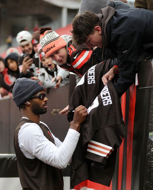 Cleveland Browns quarterback Shedeur Sanders signs autographs for fans before an NFL football game at Huntington Bank Field, Nov. 16, 2025, in Cleveland, Ohio.