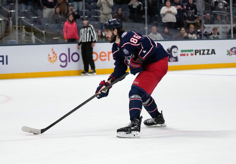 Columbus Blue Jackets right wing Kirill Marchenko (86) skates in and scores a goal against Montréal Canadiens goaltender Jakub Dobes (75) in shootout during the NHL game at Nationwide Arena on Nov. 17, 2025.