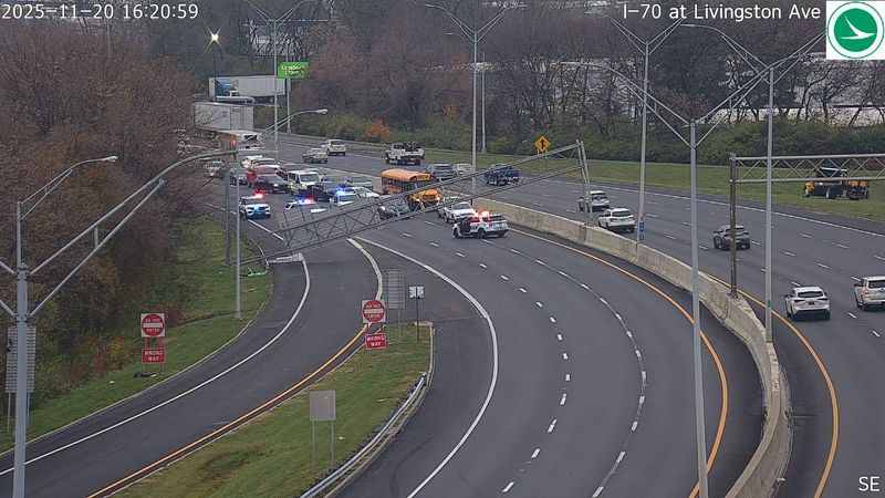 An overhead support for a highway sign on Interstate 70 westbound at Exit 103/Livingston Avenue sits on the highway after being struck by the raised bed of a dump truck on Nov. 20, 2025, one of two signs damaged by the truck, Columbus police say.