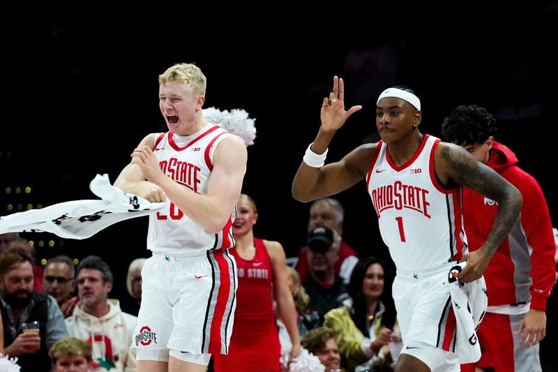 Ohio State Buckeyes forward Colin White (20) and forward Amare Bynum (1) celebrate after a three point shot was made in the first half of the NCAA basketball game at Value City Arena on Thursday, Nov. 20, 2025 in Columbus, Ohio.