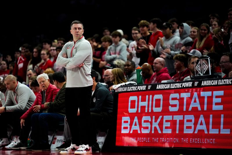 Ohio State Buckeyes head coach Jake Diebler looks at the Western Michigan Broncos bench in the first half of the NCAA basketball game at Value City Arena on Thursday, Nov. 20, 2025 in Columbus, Ohio.