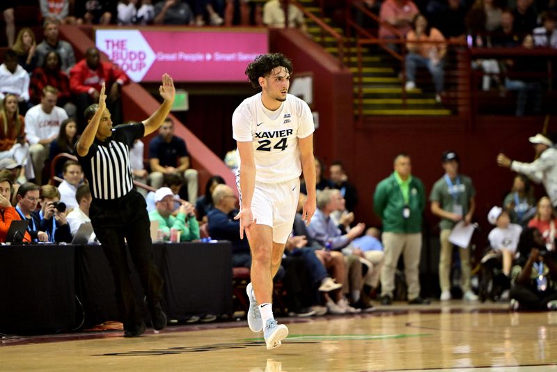 Xavier forward Jovan Milicevic (24) celebrates a 3-pointer against Georgia in the 2025 Charleston Classic Friday, Nov. 21, 2025.