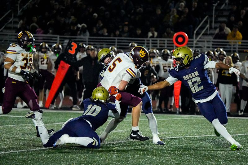 Walsh Jesuit’s Marty Tobin (5) on a run play in an OHSAA Division II regional final against Hoban, Nov. 21, 2025, at Bearcats Stadium in Bedford, Ohio.