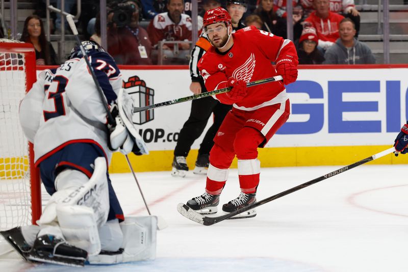 Nov 22, 2025; Detroit, Michigan, USA; Detroit Red Wings right wing Alex Debrincat (93) scores on Columbus Blue Jackets goaltender Jet Greaves (73) in overtime at Little Caesars Arena. Mandatory Credit: Rick Osentoski-Imagn Images