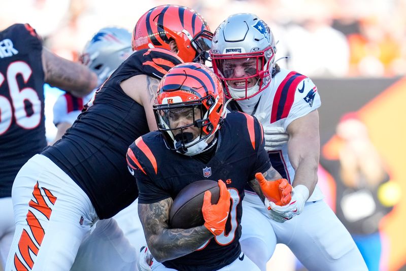 Cincinnati Bengals running back Chase Brown (30) runs the ball in the second quarter of the NFL Week 12 game between the Cincinnati Bengals and the New England Patriots at Paycor Stadium in downtown Cincinnati on Sunday, Nov. 23, 2025.