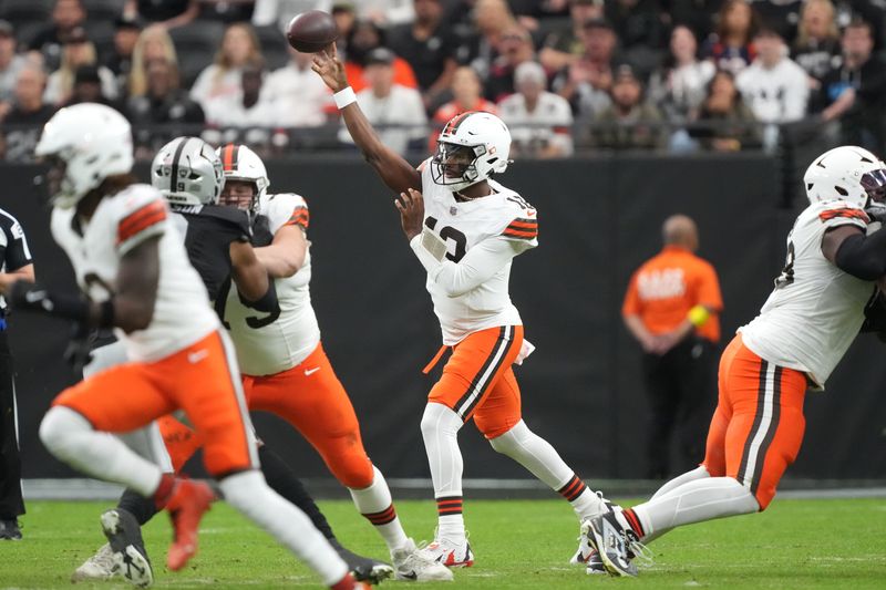 Nov 23, 2025; Paradise, Nevada, USA; Cleveland Browns quarterback Shedeur Sanders (12) throws a pass against the Las Vegas Raiders in the first half at Allegiant Stadium. Mandatory Credit: Kirby Lee-Imagn Images