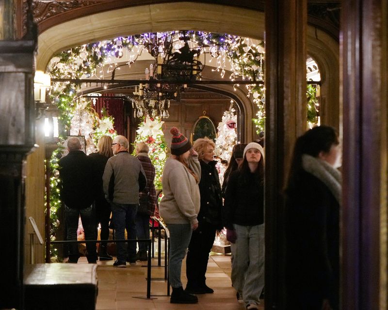 Visitors take in the decorations during a preview of Deck the Hall at Stan Hywet Hall and Gardens in Akron on Nov. 21, 2025.