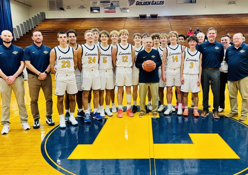 Lancaster basketball coach Kent Riggs was presented with the game ball after the Golden Gales' 80-25 win over Briggs Nov. 26, 2025. It was his 500th career coaching win.