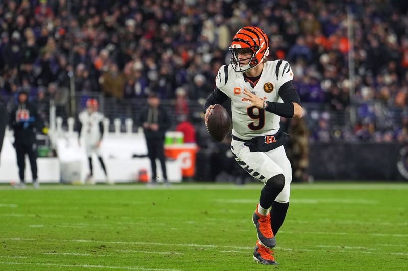 Nov 27, 2025; Baltimore, Maryland, USA; Cincinnati Bengals quarterback Joe Burrow (9) drops back to pass against the Baltimore Ravens during the first half at M&T Bank Stadium. Mandatory Credit: Mitch Stringer-Imagn Images