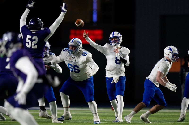 St. Xavier quarterback Jackson Frey throws a pass in the first quarter of a state semifinal against Middletown, Nov. 28, 2025.