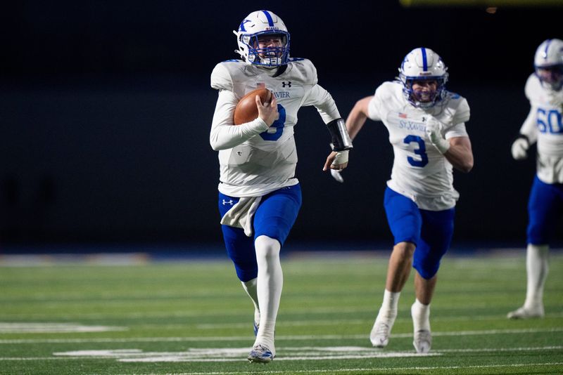 St. Xavier Bombers quarterback Jackson Frey (8) runs the ball in the first quarter of the OHSAA State Semi-Final football game between Middletown Middies and St. Xavier Bombers at Welcome Stadium in Dayton on Nov. 28, 2025.