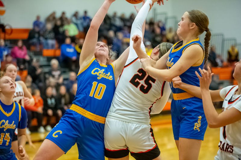 Clyde's Taitum Jeffrey, left, puts up a shot against Gibsonburg's Emily Henderson.