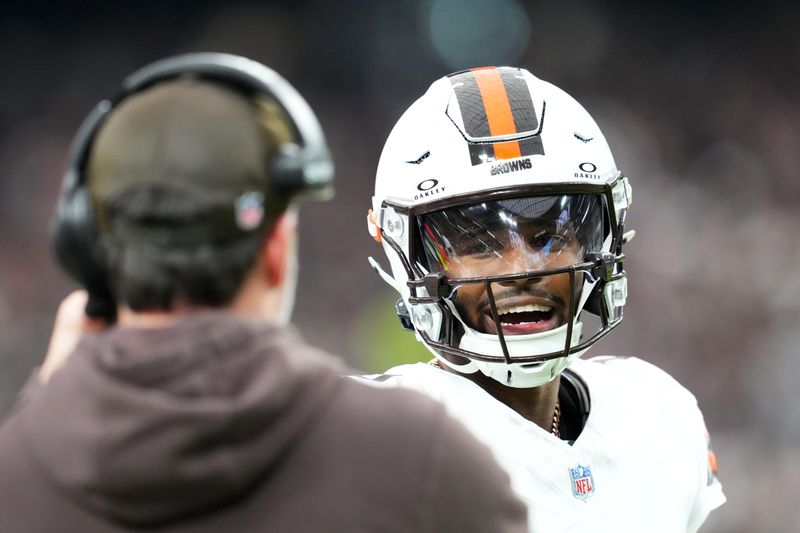 Nov 23, 2025; Paradise, Nevada, USA; Cleveland Browns quarterback Shedeur Sanders (12) talks to head coach Kevin Stefanski in the first half against the Las Vegas Raiders at Allegiant Stadium. Mandatory Credit: Stephen R. Sylvanie-Imagn Images