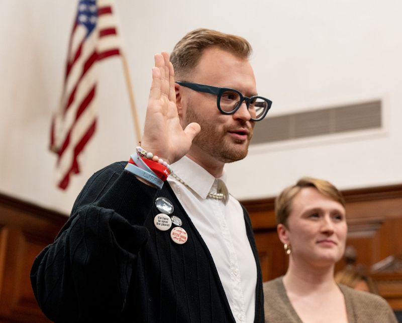Fran Wilson, with their sister Joan Wilson by their side, is sworn in as the new Ward 1 Councilperson in Akron on Dec. 1, 2025.