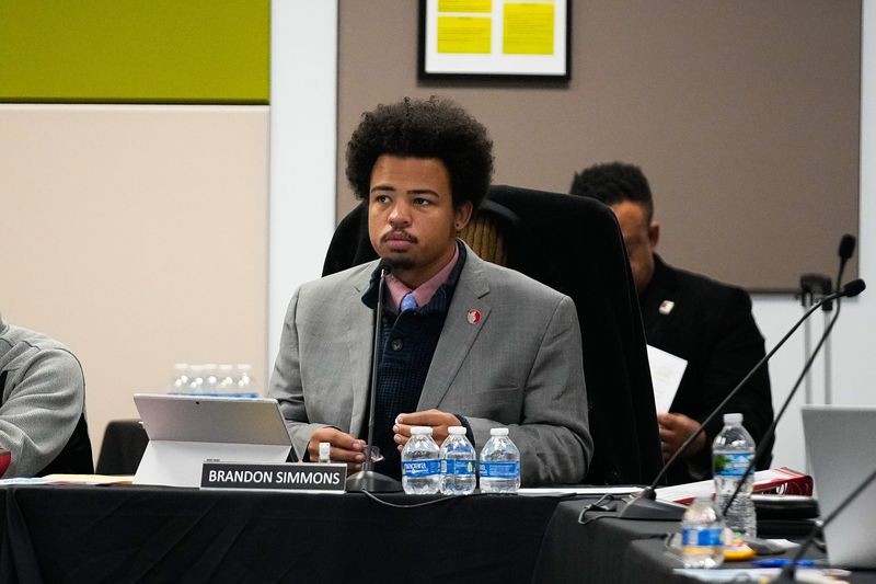 Board member Brandon Simmons listens to a community member speak during the Columbus City School board meeting at Columbus City Schools Southland Center on Tuesday, Dec. 2, 2025 in Columbus, Ohio.