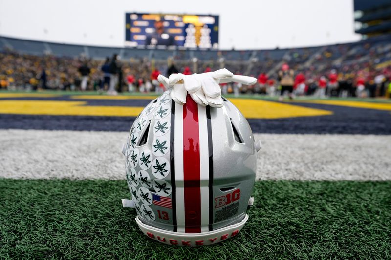 An Ohio State Buckeyes helmet sits behind the endzone as the team warms up for its game against the Michigan Wolverines during the NCAA football game at Michigan Stadium in Ann Arbor, Mich. on Nov. 29, 2025. Ohio State won 27-9.
