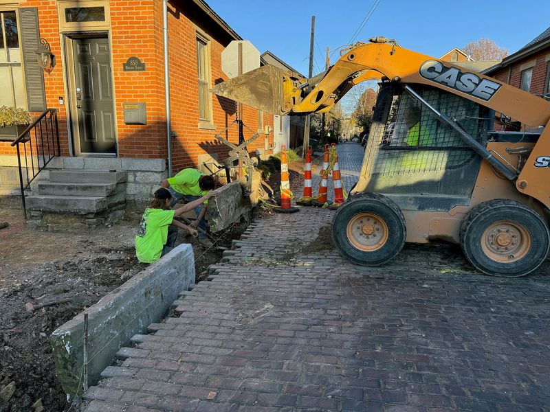 A construction crew works on the brick street in German Village on November 8, 2024.